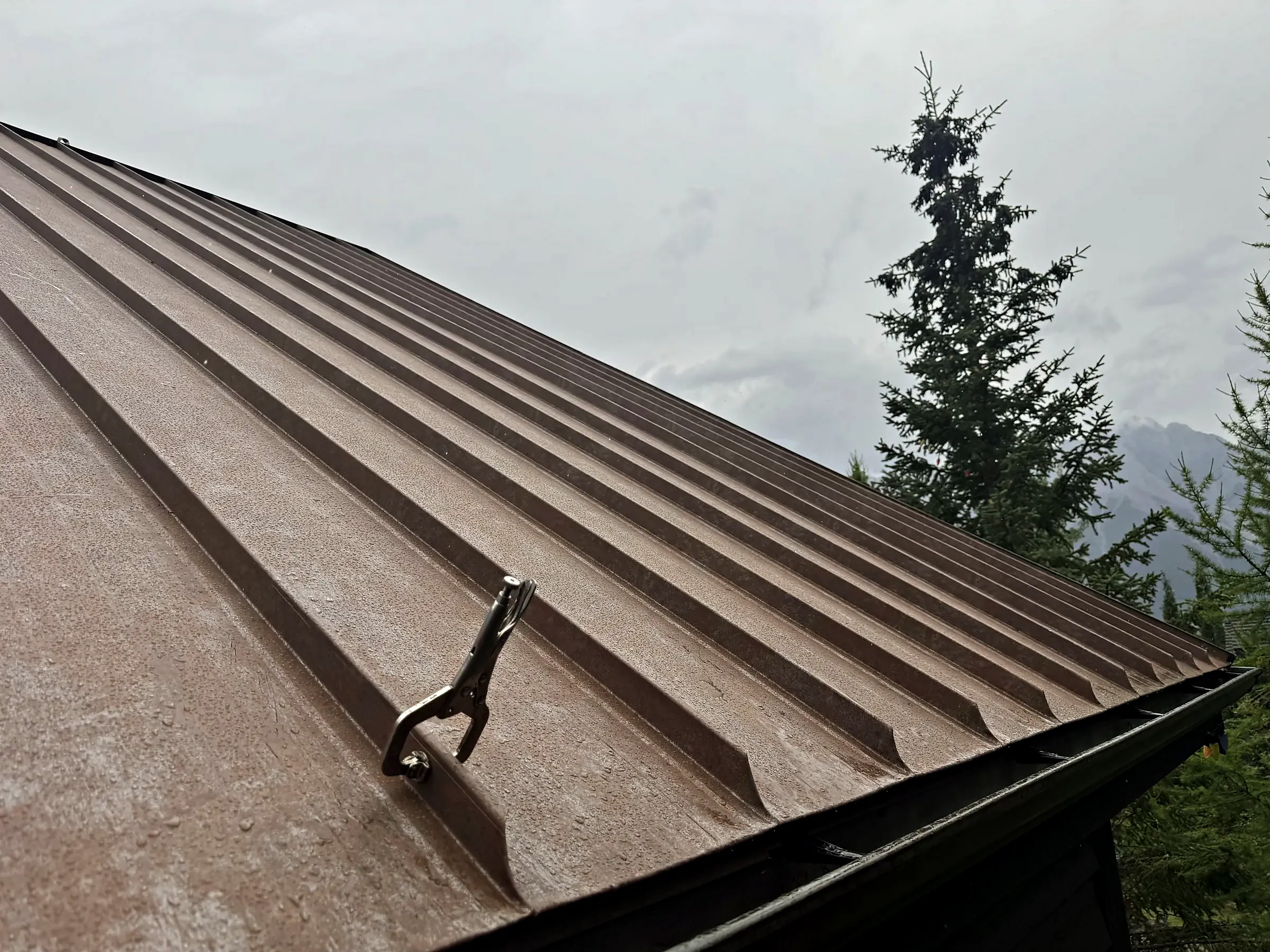 Seaming clamp on a standing seam steel roof