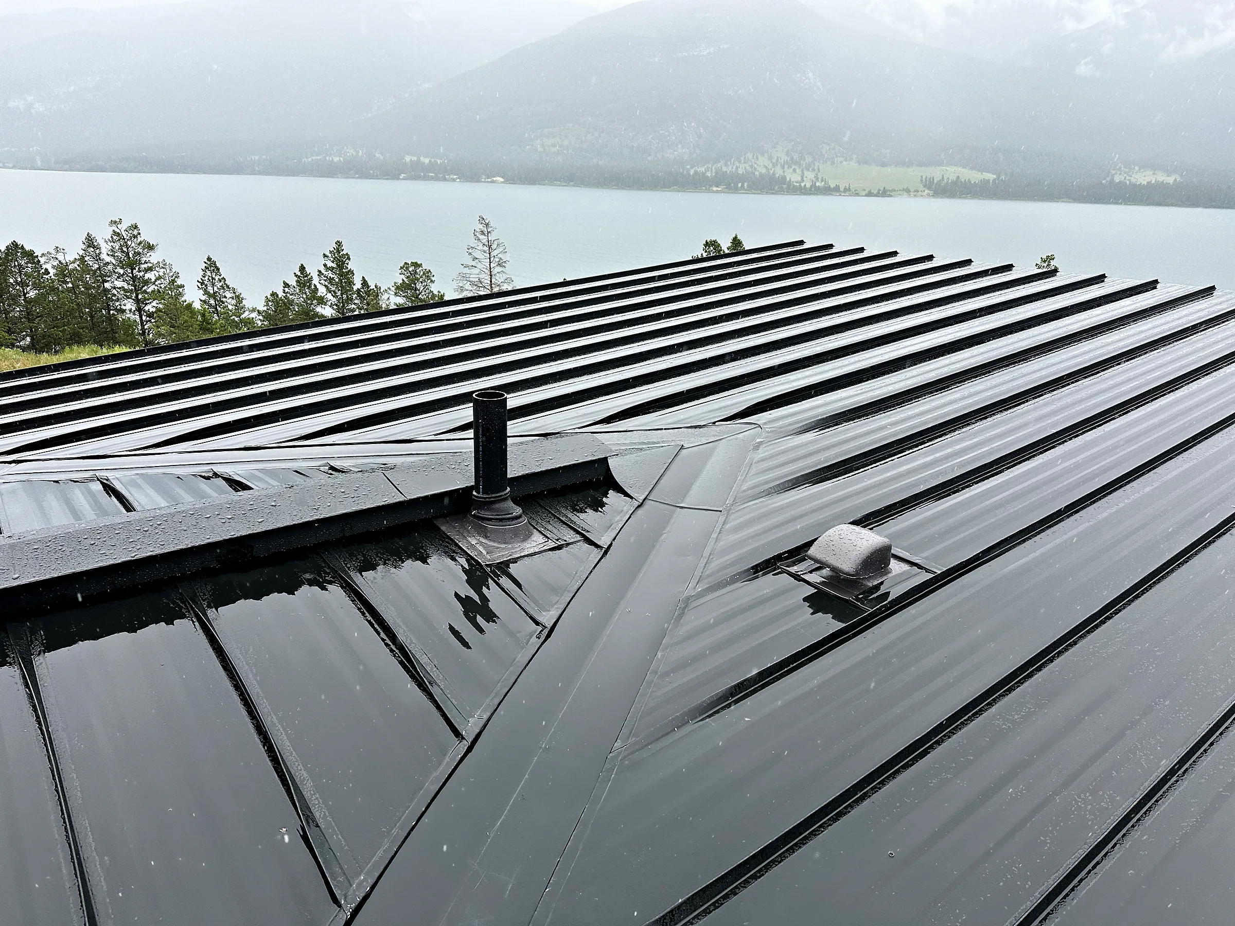 Standing seam steel roof above a lake in British Columbia