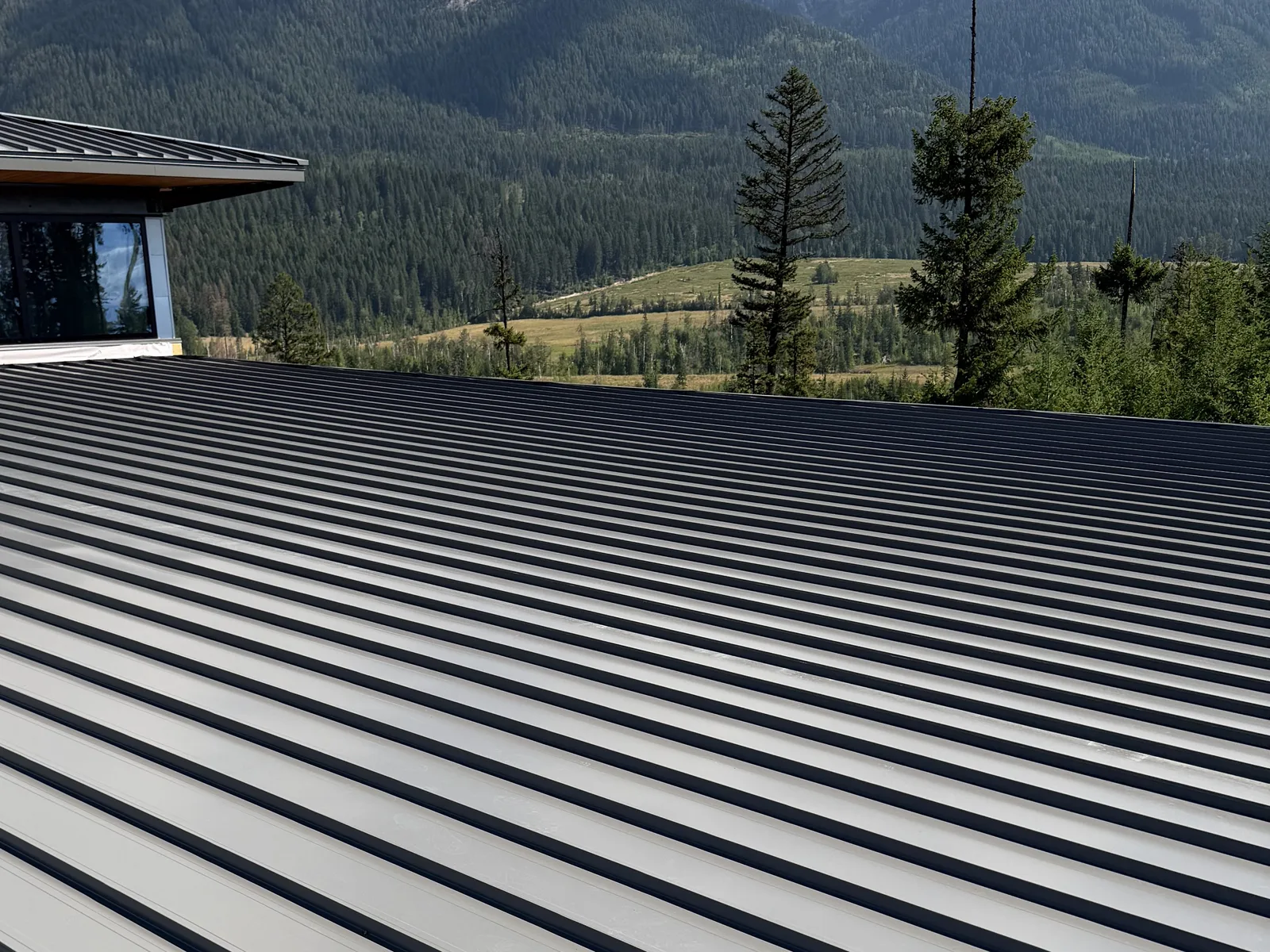 Low-slope standing seam steel roof in Golden, BC
