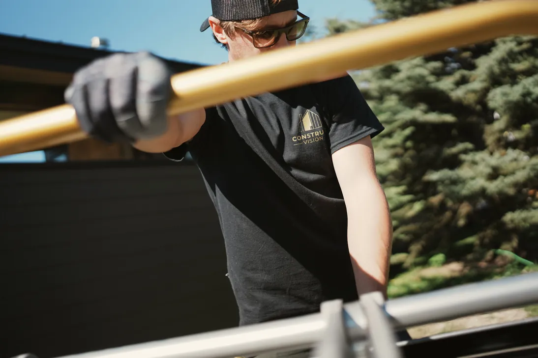 Crew member carrying a panel