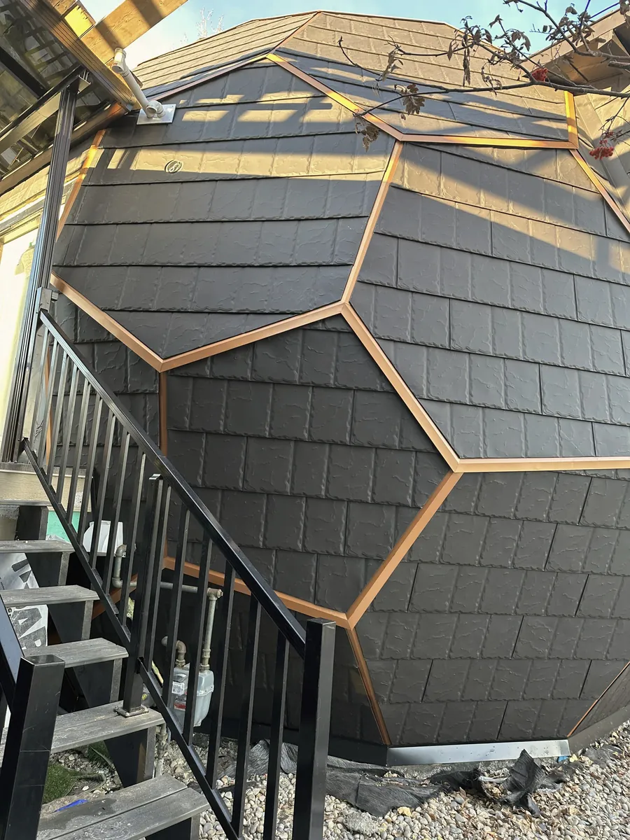 Close-up of bronze-coloured trim along the dome facets