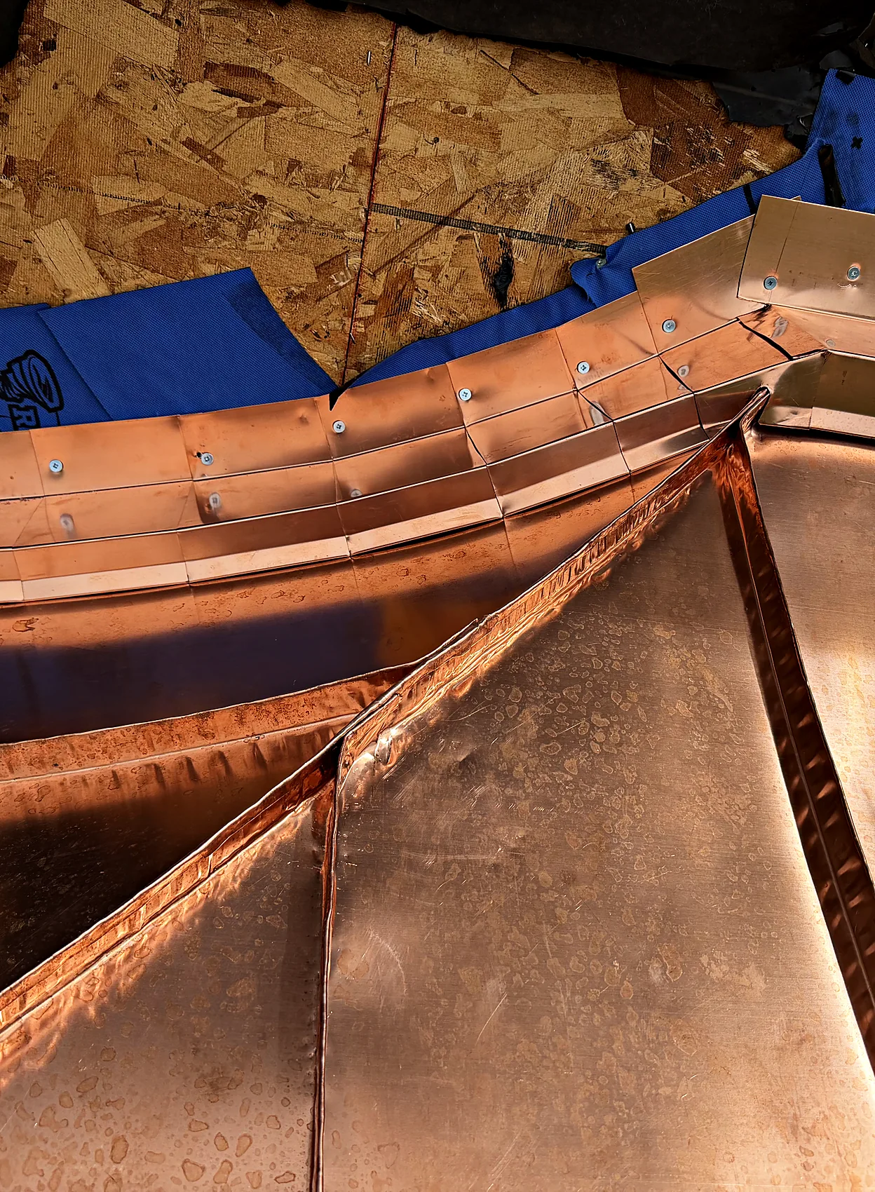 Standing seam copper on a bay roof