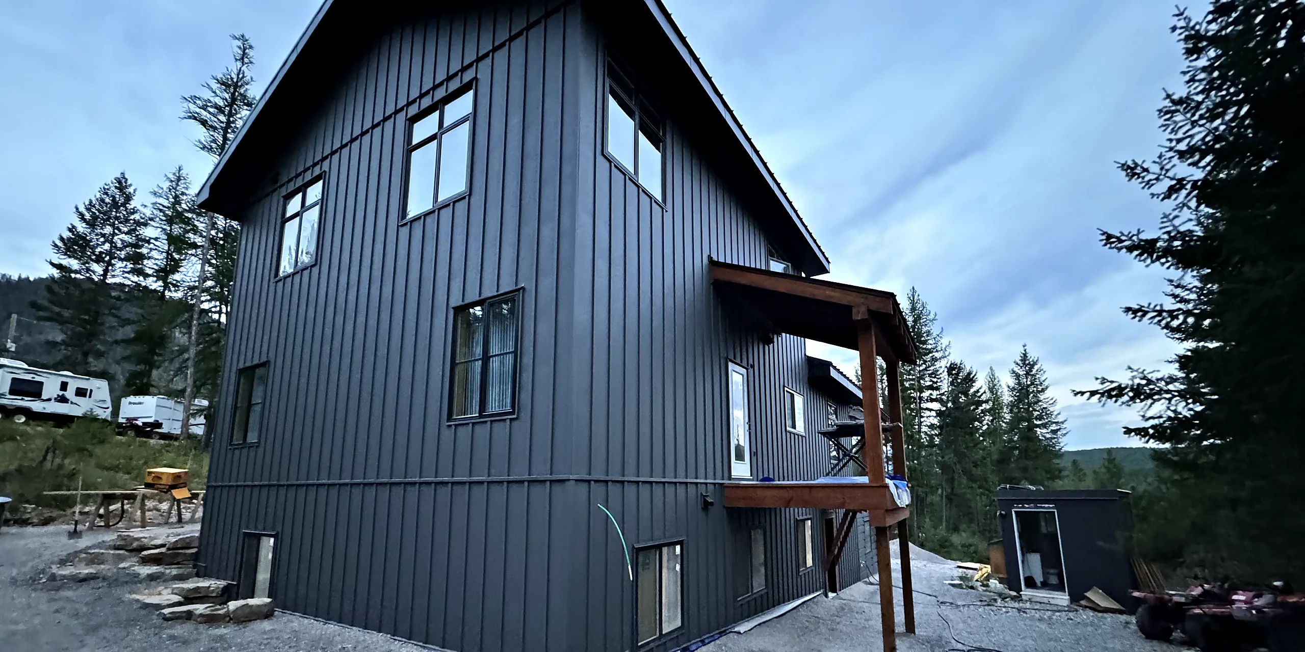 House clad in dark vertical metal siding
