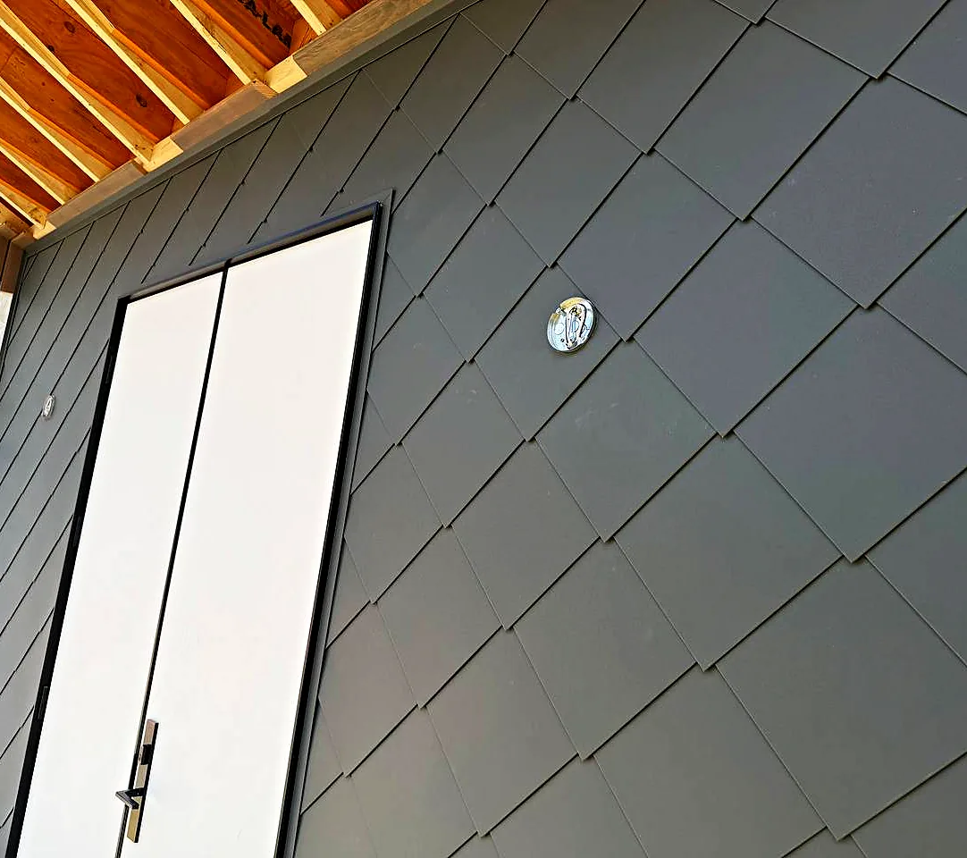 Zinc diamond panels around a door