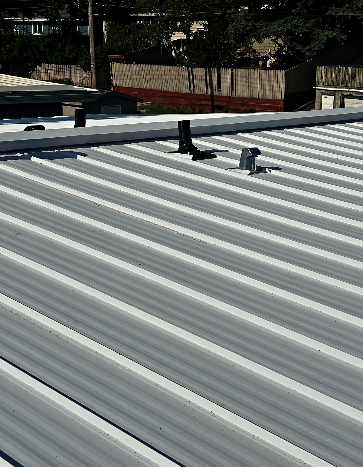 Ridge cap flashing on a standing seam roof